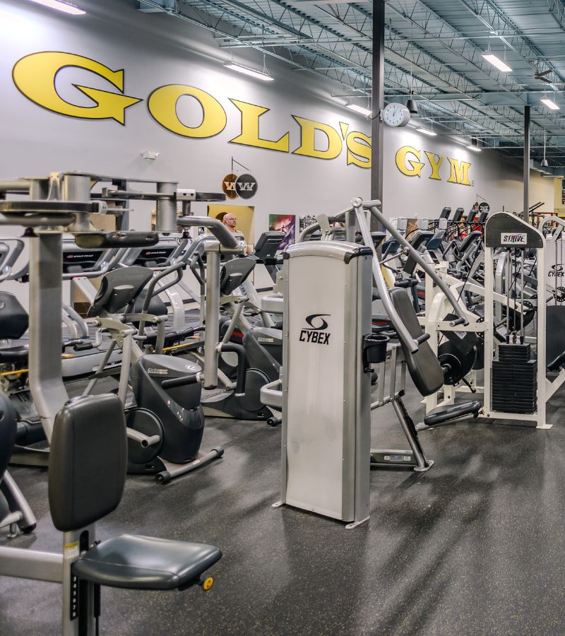 Weightlifting and strength training equipment at Gold’s Gym East End in Richmond VA, featuring Cybex machines and a spacious workout floor.